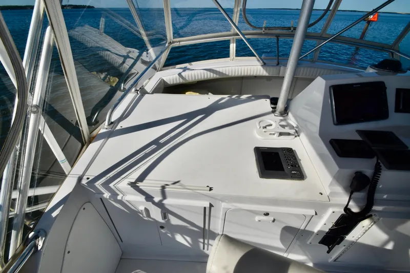 Slide: The Image of Interior view of 1982 Bertram 46 Convertible yacht cockpit with navigation equipment. - 47