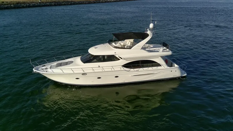 Slide: The Image of 2004 Meridian 580 Pilothouse yacht cruising on open water. - 17