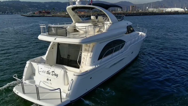 Slide: The Image of 2004 Meridian 580 Pilothouse yacht cruising on open water. - 19