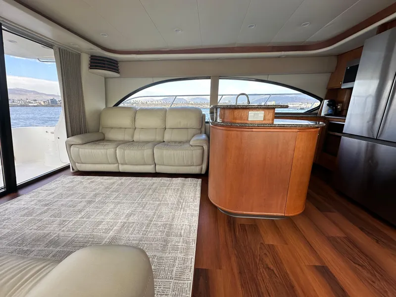 Slide: The Image of Luxurious 2004 Meridian 580 Pilothouse interior with leather seating and wooden flooring. - 29