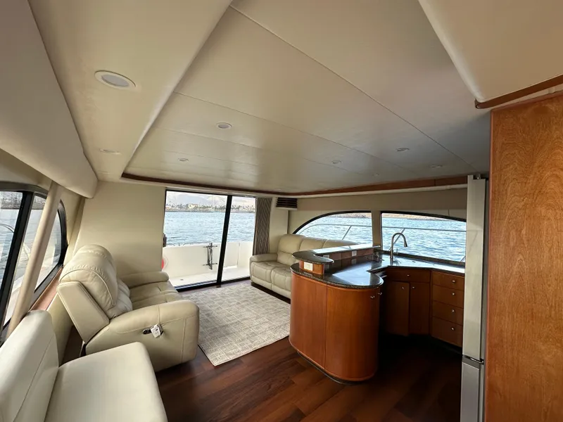 Slide: The Image of Luxurious interior of 2004 Meridian 580 Pilothouse yacht with leather seating and wood finishes. - 32