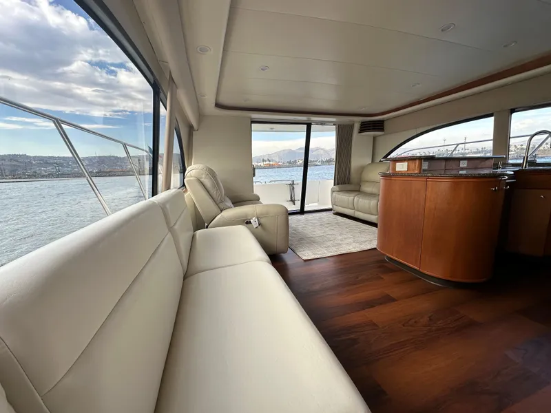 Slide: The Image of Luxurious interior of 2004 Meridian 580 Pilothouse yacht with leather seating and panoramic windows. - 33
