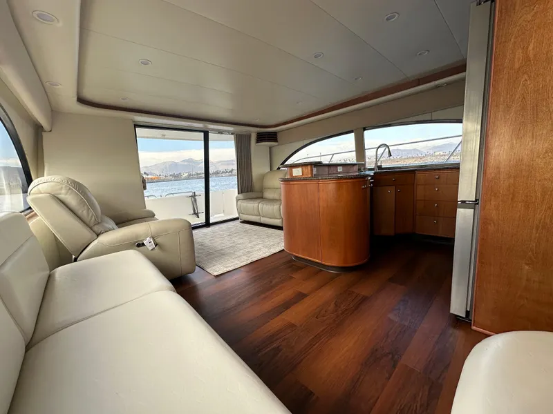 Slide: The Image of Luxurious interior of 2004 Meridian 580 Pilothouse yacht with leather seating and wood flooring. - 34