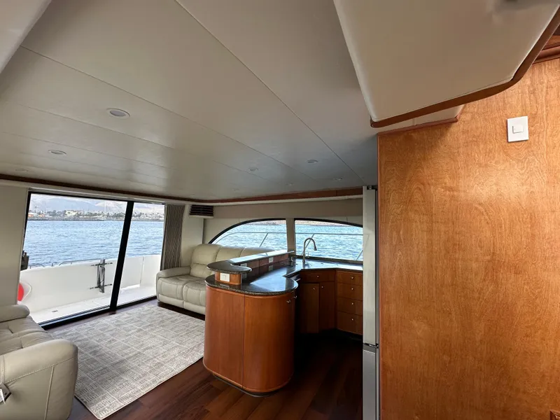 Slide: The Image of Interior of 2004 Meridian 580 Pilothouse yacht with elegant seating and panoramic windows. - 35