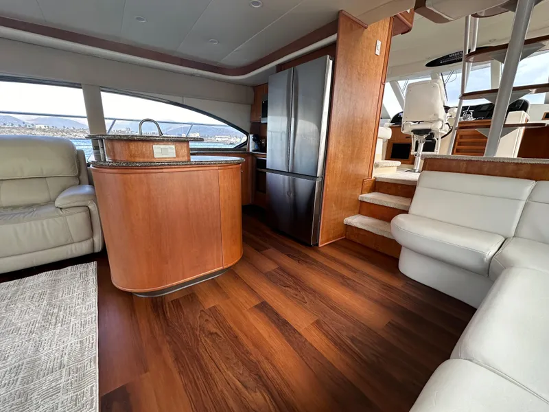 Slide: The Image of Luxurious interior of 2004 Meridian 580 Pilothouse yacht with wood flooring and modern furnishings. - 36