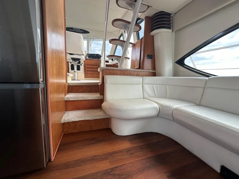 Slide: The Image of Luxurious interior of 2004 Meridian 580 Pilothouse with white seating and wooden accents. - 38