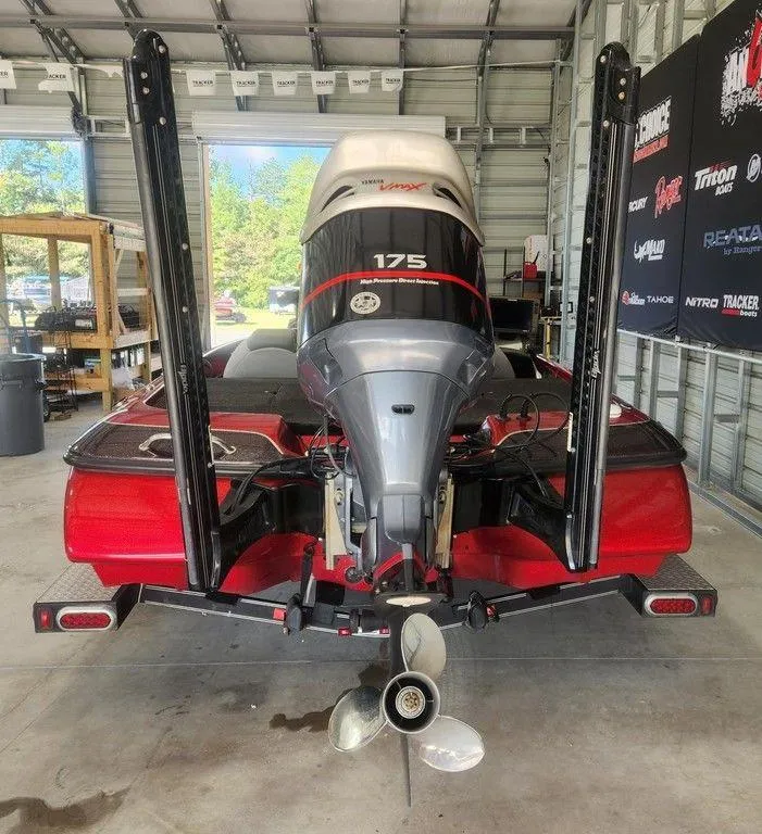 Slide: The Image of 2013 Skeeter TZX 190 boat with 175 HP engine in a garage setting. - 3