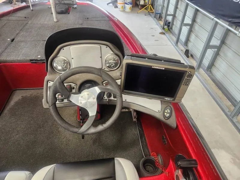Slide: The Image of 2013 Skeeter TZX 190 boat dashboard with steering wheel and Lowrance HDS-12 display. - 4
