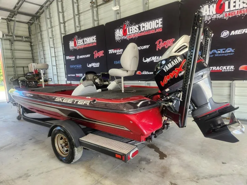 Slide: The Image of 2013 Skeeter TZX 190 boat with Yamaha VMAX engine in a garage setting. - 7