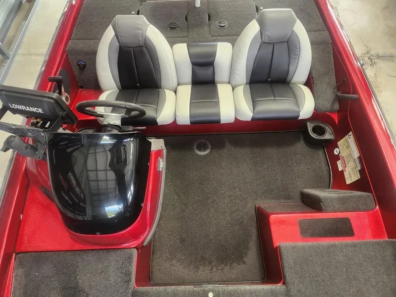 Slide: The Image of 2013 Skeeter TZX 190 boat interior with dual-tone seats and steering console. - 9