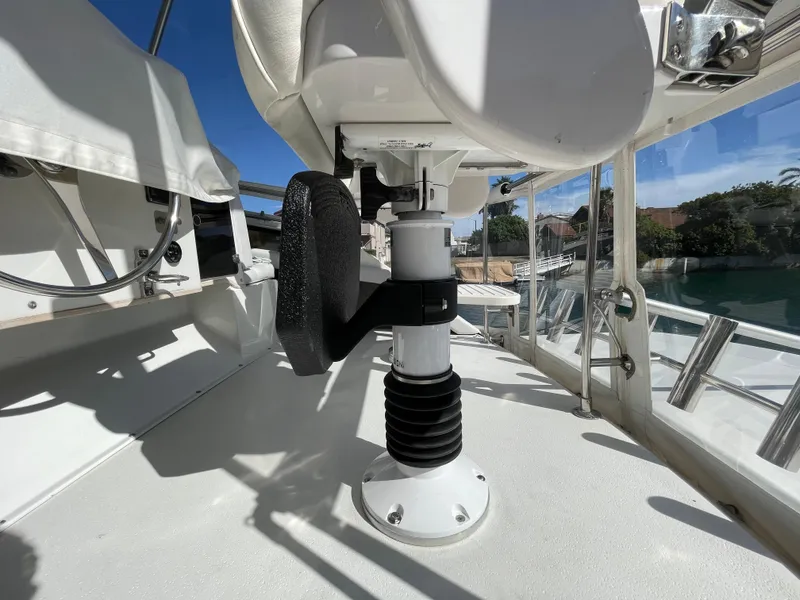 Slide: The Image of 1988 Trojan 12 Meter Convertible yacht with ladder and storage compartments. - 16