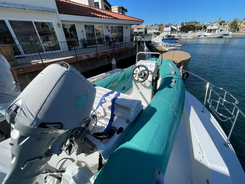 Slide: The Image of 1988 Trojan 12 Meter Convertible yacht docked in sunny marina. - 31