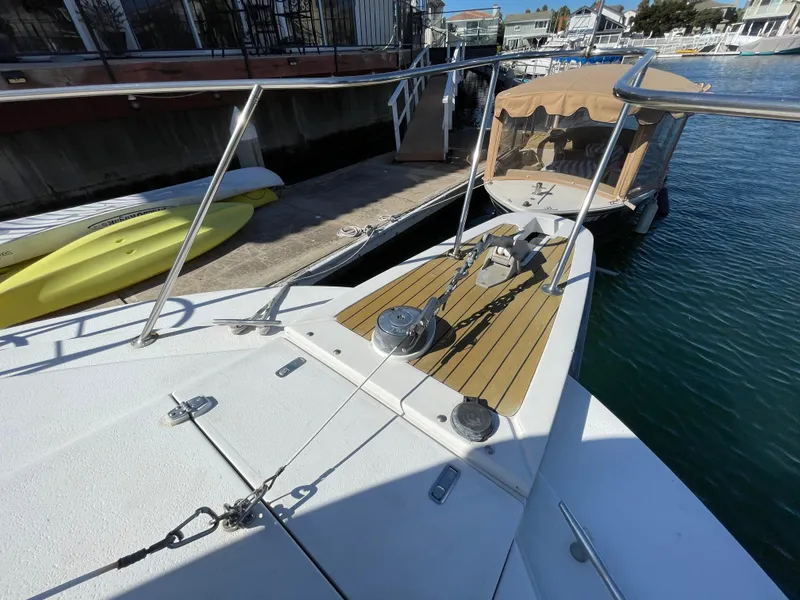 Slide: The Image of 1988 Trojan 12 Meter Convertible yacht docked in sunny marina. - 33