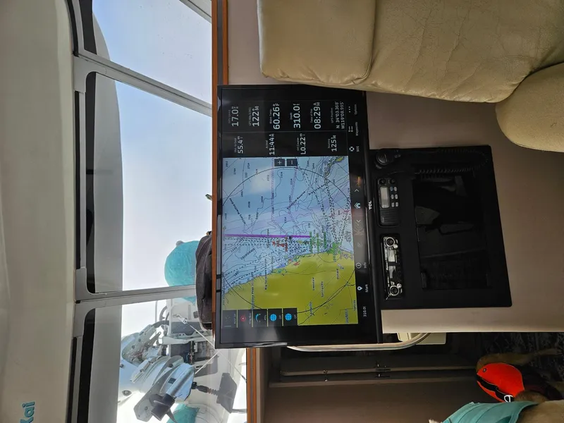 Slide: The Image of Interior of 1988 Trojan 12 Meter Convertible yacht with beige sofa and large windows. - 40