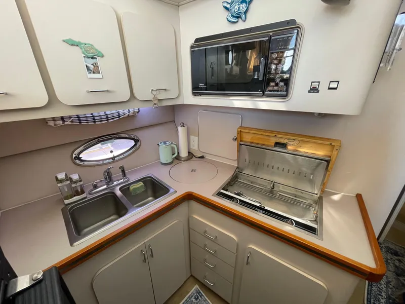 Slide: The Image of Interior of 1988 Trojan 12 Meter Convertible yacht with mounted TV and audio system. - 43
