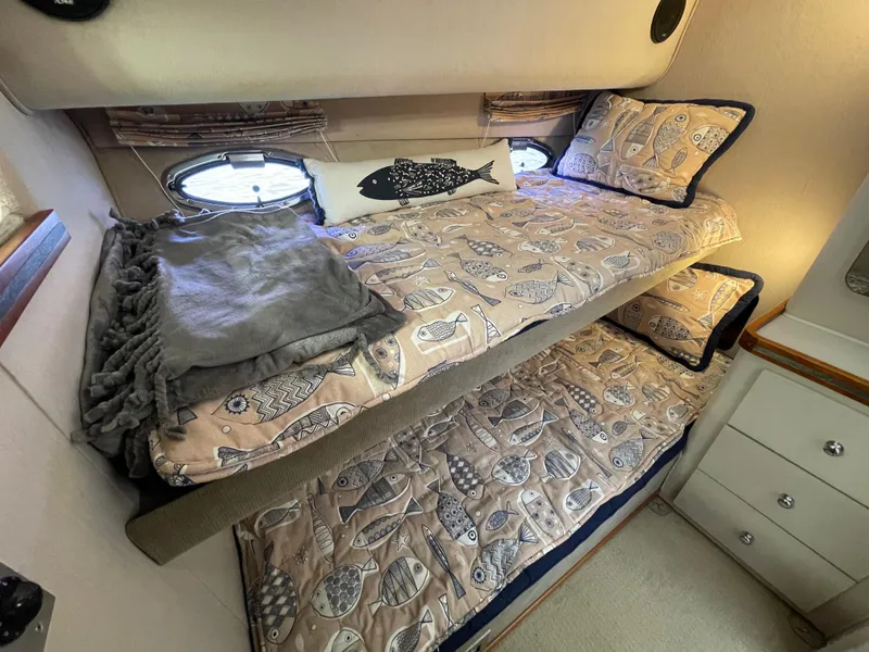 Slide: The Image of 1988 Trojan 12 Meter Convertible yacht kitchen with modern appliances and compact design. - 46