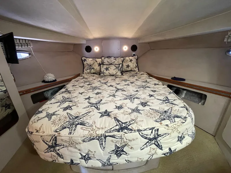 Slide: The Image of 1988 Trojan 12 Meter Convertible yacht kitchen with sink, stove, and microwave. - 47