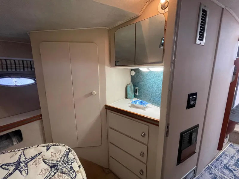 Slide: The Image of Control panel of a 1988 Trojan 12 Meter Convertible boat, featuring gauges and switches. - 49