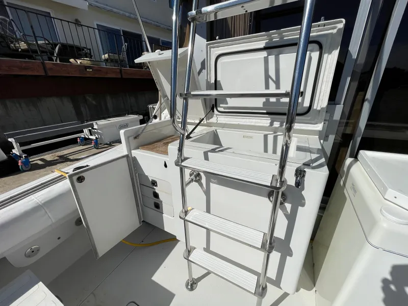 Slide: The Image of 1988 Trojan 12 Meter Convertible boat deck at marina. - 13