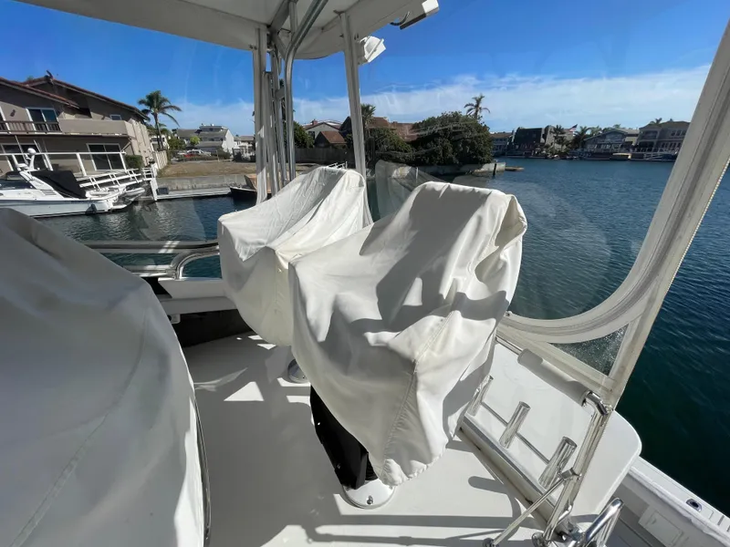 Slide: The Image of 1988 Trojan 12 Meter Convertible yacht with ladder and open storage compartment. - 17