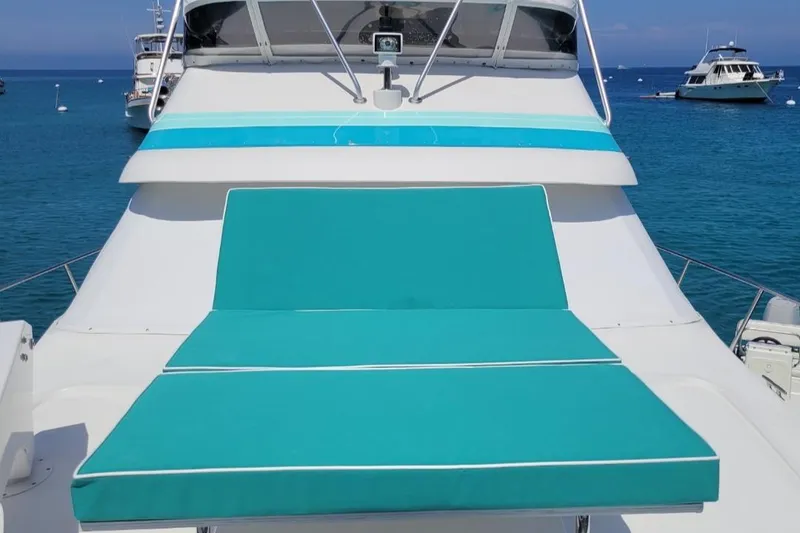 Slide: The Image of 1988 Trojan 12 Meter Convertible yacht interior with marina view. - 28