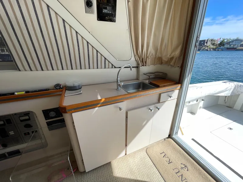 Slide: The Image of Luxurious interior of a 1988 Trojan 12 Meter Convertible yacht with plush seating. - 38