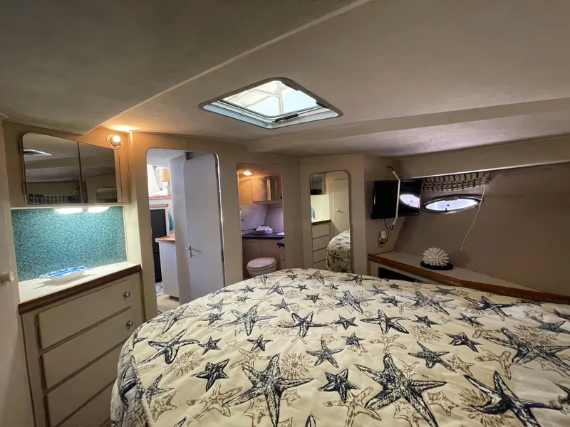 Slide: The Image of 1988 Trojan 12 Meter Convertible yacht kitchen with sink, cabinets, and appliances. - 48
