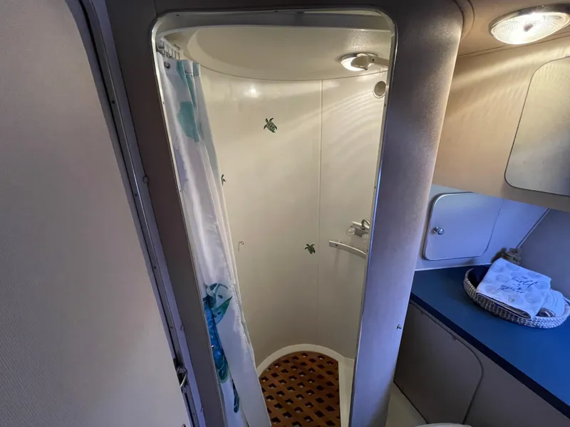 Slide: The Image of 1988 Trojan 12 Meter Convertible yacht bedroom with starfish-themed bedding. - 51