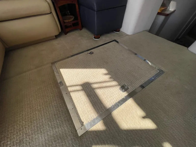 Slide: The Image of Interior of 1988 Trojan 12 Meter Convertible yacht with starfish bedding and modern amenities. - 52