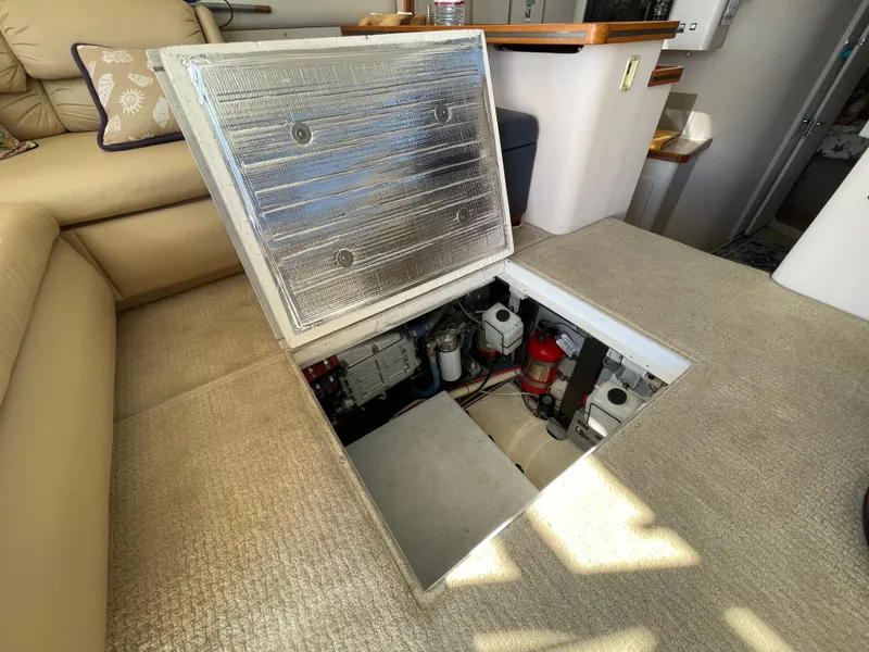 Slide: The Image of 1988 Trojan 12 Meter Convertible yacht interior with cabinets and mirror. - 53