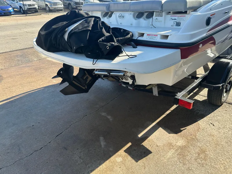 Slide: The Image of 2011 Bayliner 185 boat on trailer, rear view with outboard motor. - 15