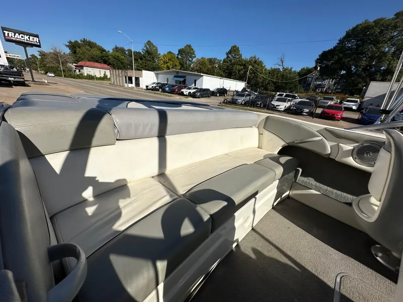 Slide: The Image of 2011 Bayliner 185 boat interior with gray and white seating. - 23