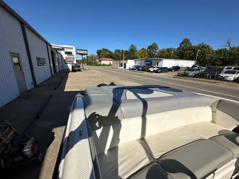 Slide: The Image of 2011 Bayliner 185 boat parked outside dealership on sunny day. - 24