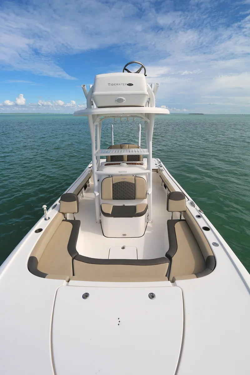 Slide: The Image of 2021 Tidewater 2500 Carolina Bay boat on calm sea under blue sky. - 6