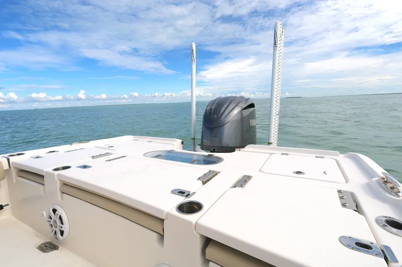 Slide: The Image of Tidewater 2500 Carolina Bay 2021 boat on calm ocean with clear blue sky. - 7