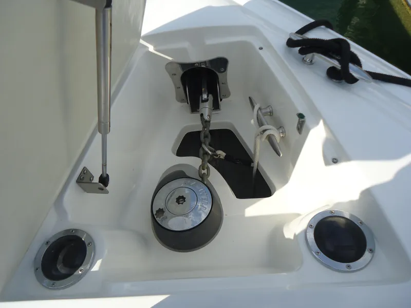 Slide: The Image of Anchor compartment of a 2007 Cobalt 302 boat with chain and winch. - 10