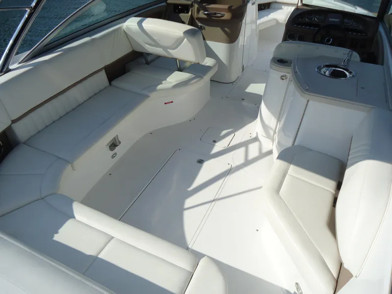 Slide: The Image of 2007 Cobalt 302 boat interior with white seating and sleek design. - 14