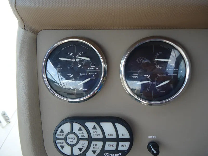 Slide: The Image of Dashboard gauges and controls on a 2007 Cobalt 302 boat. - 17
