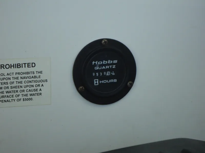 Slide: The Image of Hour meter on 2007 Cobalt 302 boat, displaying usage hours. - 21