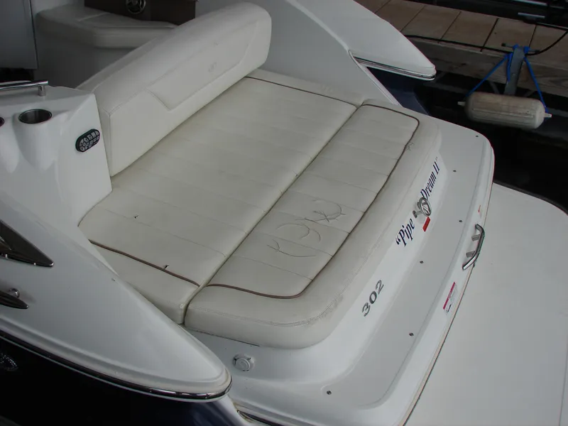 Slide: The Image of 2007 Cobalt 302 boat with white cushioned seating at the stern. - 45