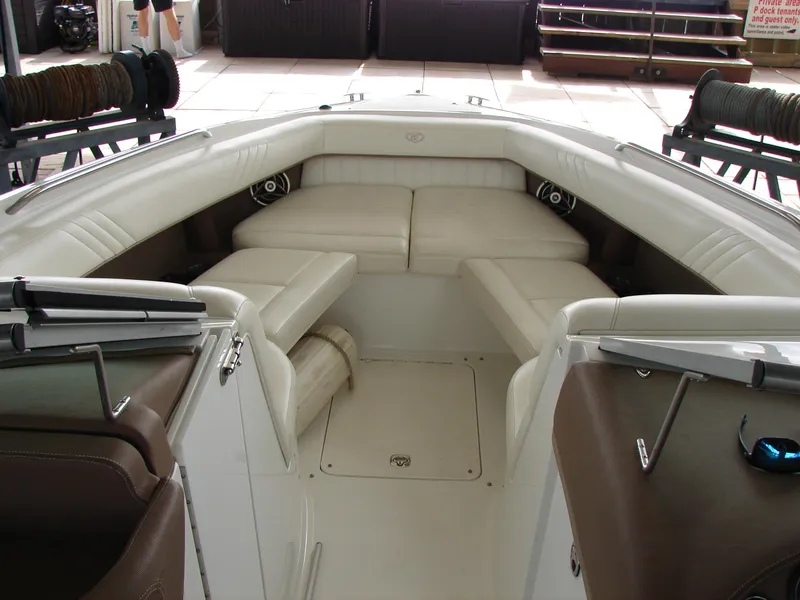Slide: The Image of 2007 Cobalt 302 boat interior with white leather seating and modern design. - 47
