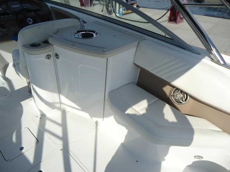 Slide: The Image of 2007 Cobalt 302 boat interior with seating and sink area. - 7