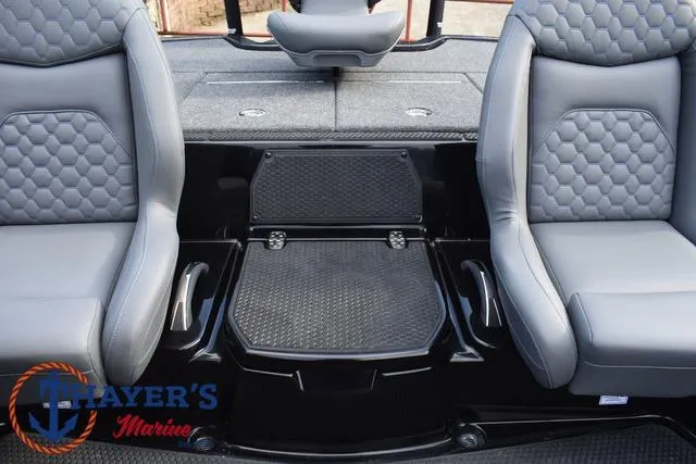 Slide: The Image of 2025 Ikon Boats VLX20 interior with gray seats and Thayer's Marine logo. - 17