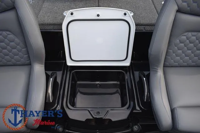 Slide: The Image of 2025 Ikon Boats VLX20 interior storage compartment between gray seats. - 18
