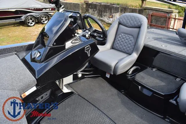 Slide: The Image of 2025 Ikon Boats VLX20 interior with steering wheel and seating at Thayer's Marine. - 22