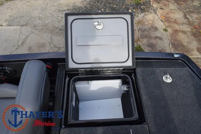 Slide: The Image of Open storage compartment on 2025 Ikon Boats VLX20 deck, featuring Thayer's Marine logo. - 29