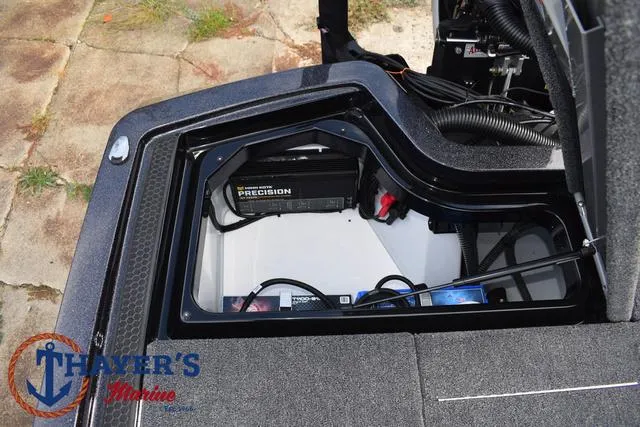 Slide: The Image of 2025 Ikon Boats VLX20 battery compartment with Precision charger. - 33