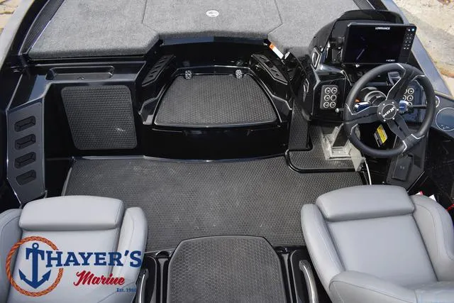 Slide: The Image of 2025 Ikon Boats VLX20 interior with modern dashboard and seating, Thayer's Marine logo visible. - 35