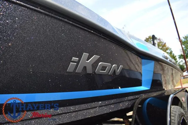 Slide: The Image of 2025 Ikon Boats VLX20 with sleek black and blue design, displayed at Thayer's Marine. - 39