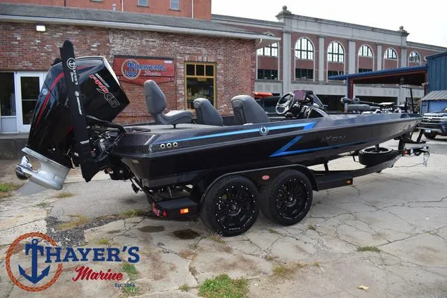 Slide: The Image of 2025 Ikon Boats VLX20 at Thayer's Marine, sleek black design with powerful outboard motor. - 42